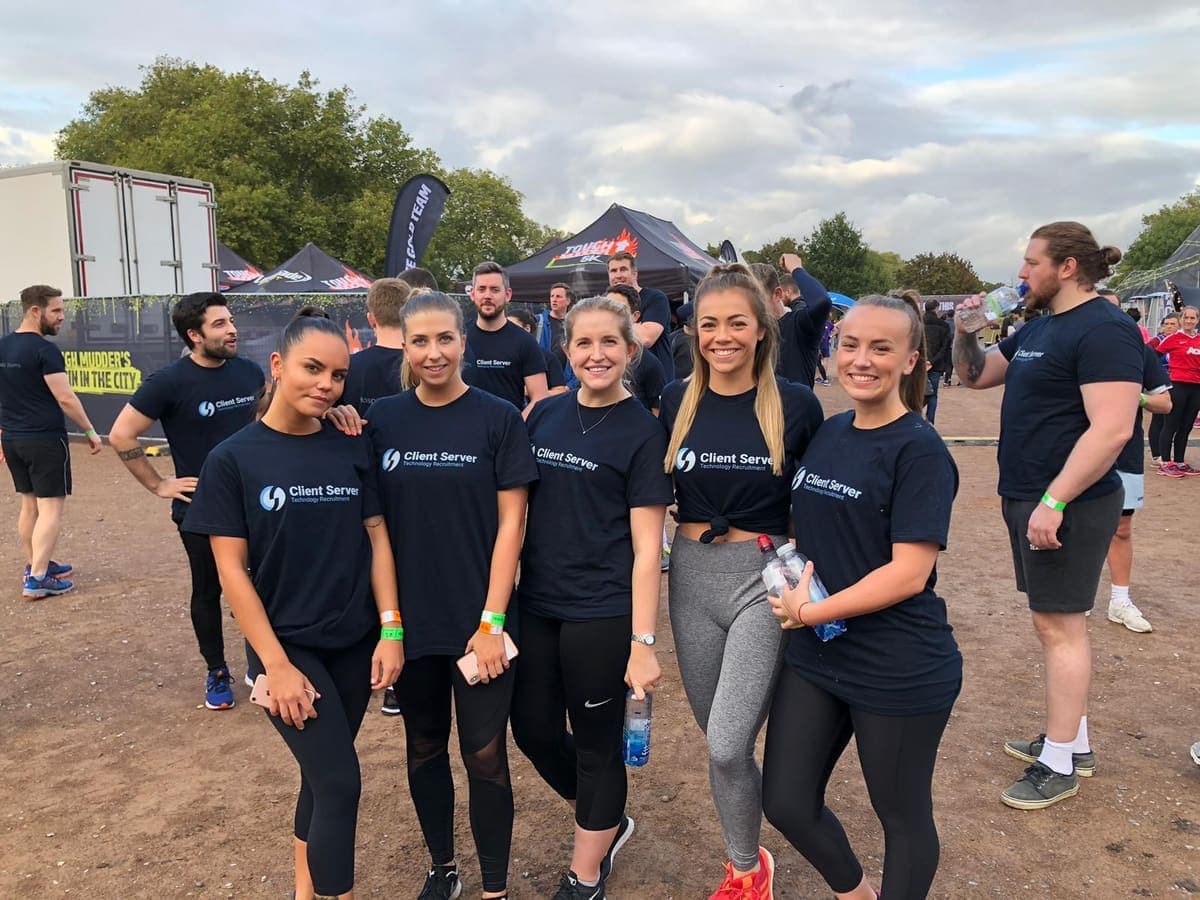 Client Server staff covered in mud after Tough Mudder